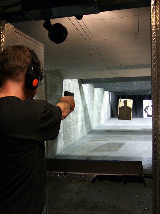 The intrepid newsletter reporter is shooting with a 9-millimeter handgun.
